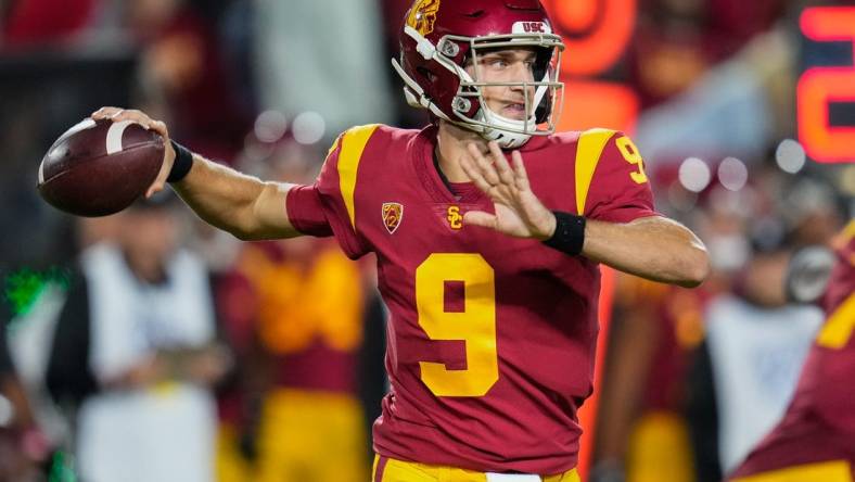 Oct 9, 2021; Los Angeles, California, USA; USC Trojans quarterback Kedon Slovis (9) throws a pass during the third quarter against the Utah Utes at United Airlines Field at Los Angeles Memorial Coliseum. Mandatory Credit: Robert Hanashiro-USA TODAY Sports