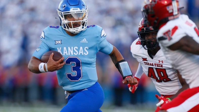 Kansas redshirt senior quarterback Miles Kendrick (3) runs for yards during the second half of Saturday, Oct. 16, 2021 game against Texas Tech at David Booth Kansas Memorial Stadium. The Jayhawks lost 41-14.