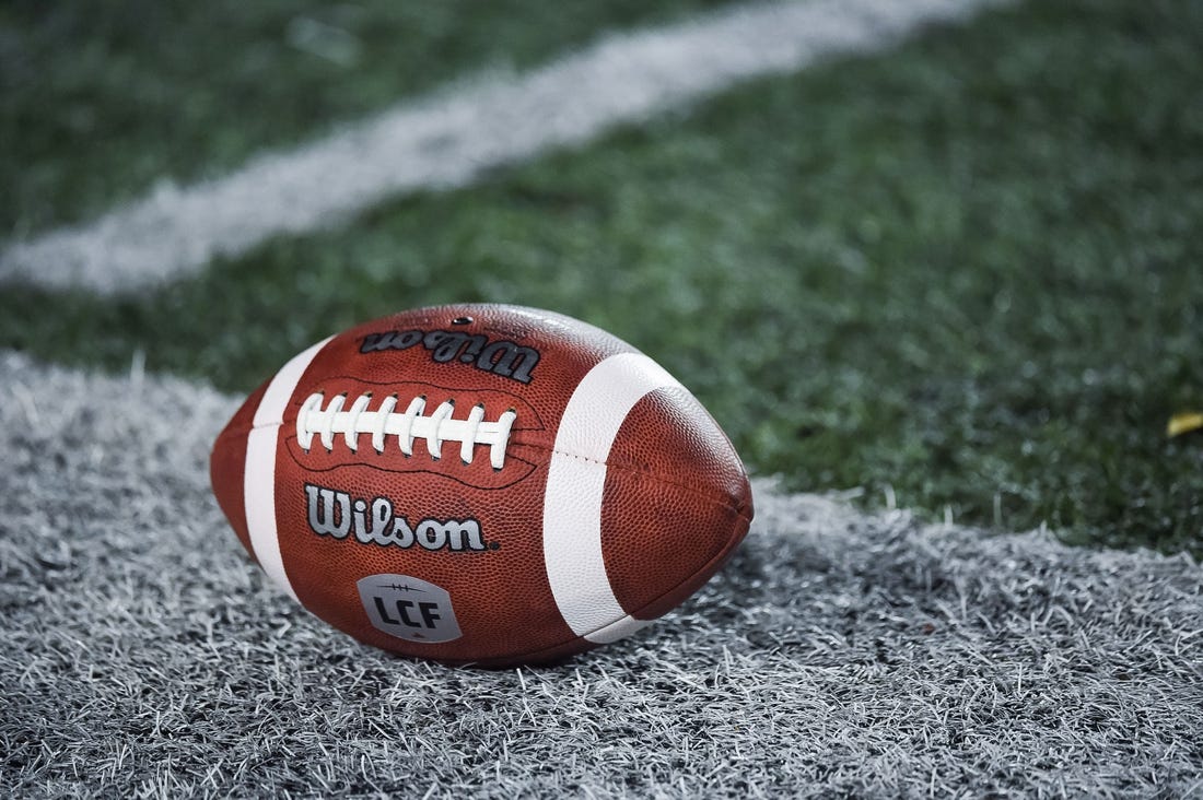 Oct 22, 2021; Montreal, Quebec, CAN; view of a CFL game ball with a french logo on the field before the first quarter during a Canadian Football League game at Molson Stadium. Mandatory Credit: David Kirouac-USA TODAY Sports