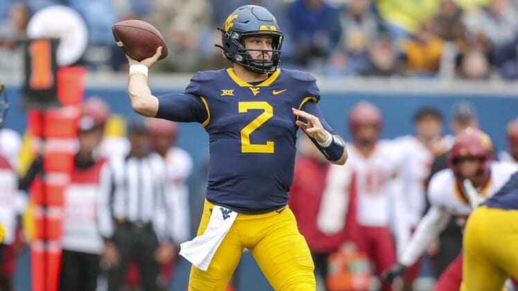Oct 30, 2021; Morgantown, West Virginia, USA; West Virginia Mountaineers quarterback Jarret Doege (2) throws a pass during the first quarter against the Iowa State Cyclones at Mountaineer Field at Milan Puskar Stadium. Mandatory Credit: Ben Queen-USA TODAY Sports