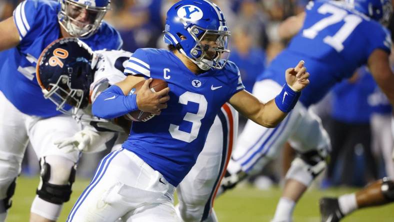 Oct 30, 2021; Provo, Utah, USA;  Brigham Young Cougars quarterback Jaren Hall (3) runs the ball in the first quarter against the Virginia Cavaliers at LaVell Edwards Stadium. Mandatory Credit: Jeffrey Swinger-USA TODAY Sports