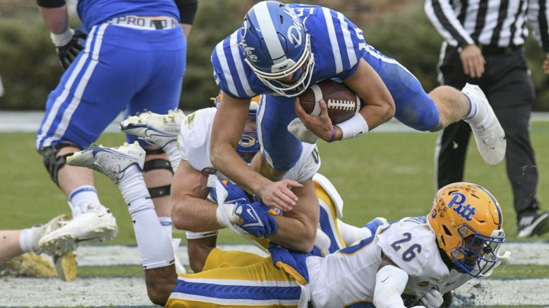 Nov 6, 2021; Durham, North Carolina, USA;  Duke Blue Devils quarterback Riley Leonard (10) is tackled on a keeper during the third quarter against the Pittsburgh Panthers at Wallace Wade Stadium. Mandatory Credit: William Howard-USA TODAY Sports