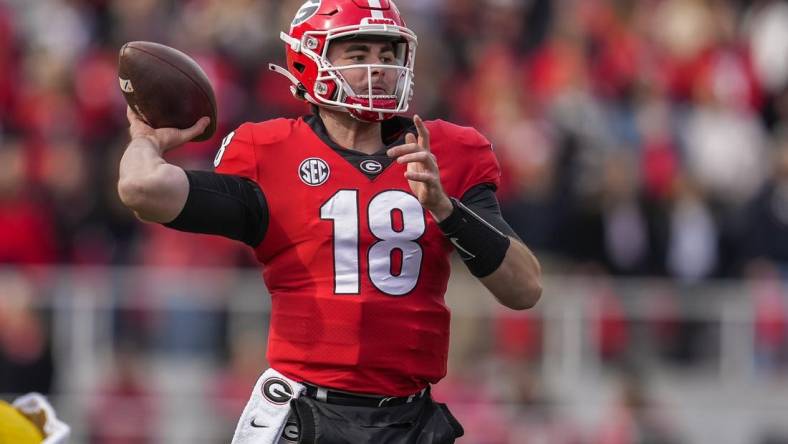 Nov 6, 2021; Athens, Georgia, USA; Georgia Bulldogs quarterback JT Daniels (18) passes the ball against the Missouri Tigers during the second half at Sanford Stadium. Mandatory Credit: Dale Zanine-USA TODAY Sports