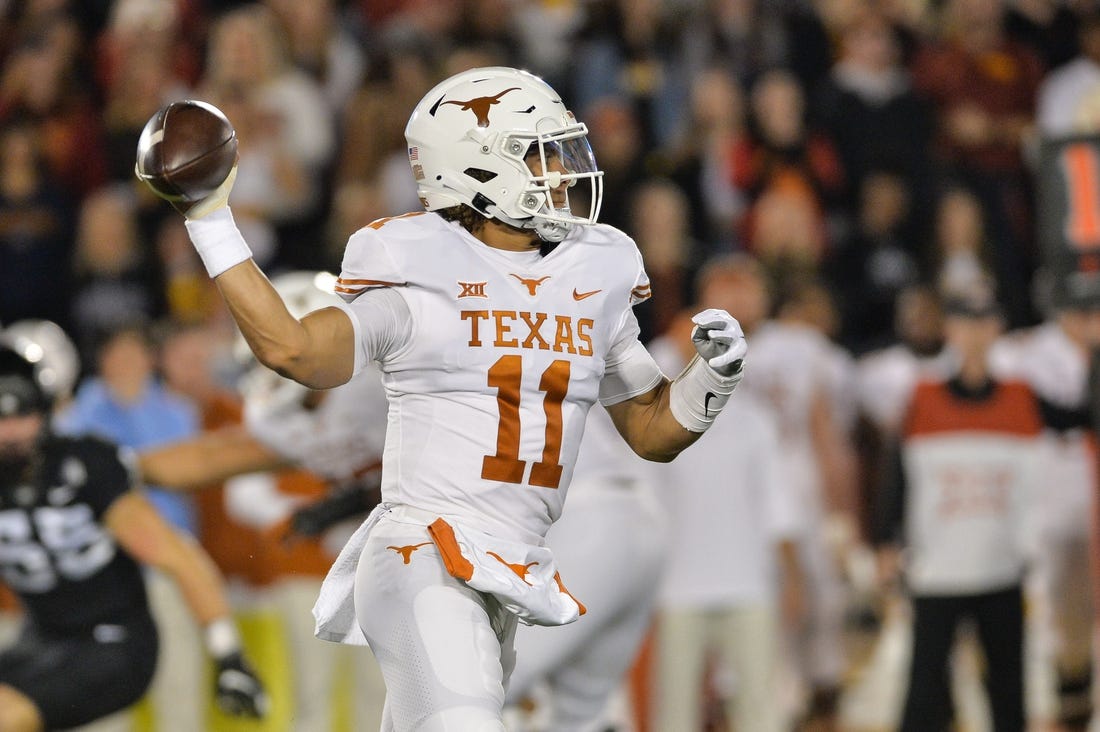 Nov 6, 2021; Ames, Iowa, USA; Texas Longhorns quarterback Casey Thompson (11) throws a pass against the Iowa State Cyclones during the first quarter at Jack Trice Stadium. Mandatory Credit: Jeffrey Becker-USA TODAY Sports