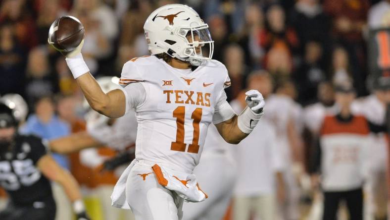 Nov 6, 2021; Ames, Iowa, USA; Texas Longhorns quarterback Casey Thompson (11) throws a pass against the Iowa State Cyclones during the first quarter at Jack Trice Stadium. Mandatory Credit: Jeffrey Becker-USA TODAY Sports