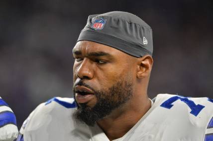 Oct 31, 2021; Minneapolis, Minnesota, USA; Dallas Cowboys offensive tackle Tyron Smith (77) looks on during the game against the Minnesota Vikings at U.S. Bank Stadium. Mandatory Credit: Jeffrey Becker-USA TODAY Sports