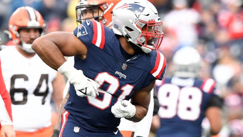 Nov 14, 2021; Foxborough, Massachusetts, USA; New England Patriots defensive end Deatrich Wise (91) reacts after sacking Cleveland Browns quarterback Baker Mayfield (not seen)  during the second half at Gillette Stadium. Mandatory Credit: Brian Fluharty-USA TODAY Sports