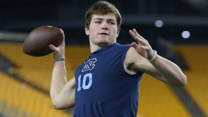 Nov 11, 2021; Pittsburgh, Pennsylvania, USA;  North Carolina Tar Heels quarterback Drake Maye (10) warms up before the game against the Pittsburgh Panthers at Heinz Field. Mandatory Credit: Charles LeClaire-USA TODAY Sports