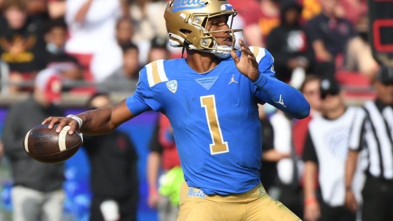 Nov 20, 2021; Los Angeles, California, USA; UCLA Bruins quarterback Dorian Thompson-Robinson (1) throws a pass against the Southern California Trojans in the first half at the Los Angeles Memorial Coliseum. Mandatory Credit: Richard Mackson-USA TODAY Sports