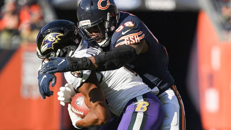 Nov 21, 2021; Chicago, Illinois, USA; Chicago Bears inside linebacker Roquan Smith (58) tackles Baltimore Ravens wide receiver Devin Duvernay (13) in the first half at Soldier Field. Mandatory Credit: Quinn Harris-USA TODAY Sports