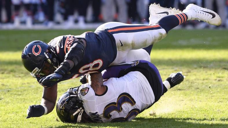 Nov 21, 2021; Chicago, Illinois, USA; Chicago Bears inside linebacker Roquan Smith (58) tackles Baltimore Ravens running back Devonta Freeman (33) in the second half at Soldier Field. Mandatory Credit: Quinn Harris-USA TODAY Sports