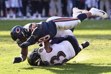 Nov 21, 2021; Chicago, Illinois, USA; Chicago Bears inside linebacker Roquan Smith (58) tackles Baltimore Ravens running back Devonta Freeman (33) in the second half at Soldier Field. Mandatory Credit: Quinn Harris-USA TODAY Sports