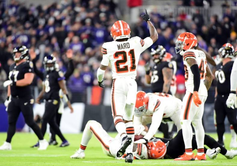 Nov 28, 2021; Baltimore, Maryland, USA; Cleveland Browns cornerback Denzel Ward (21) reacts after an interception in the second quarter against the Baltimore Ravens at M&T Bank Stadium. Mandatory Credit: Evan Habeeb-USA TODAY Sports