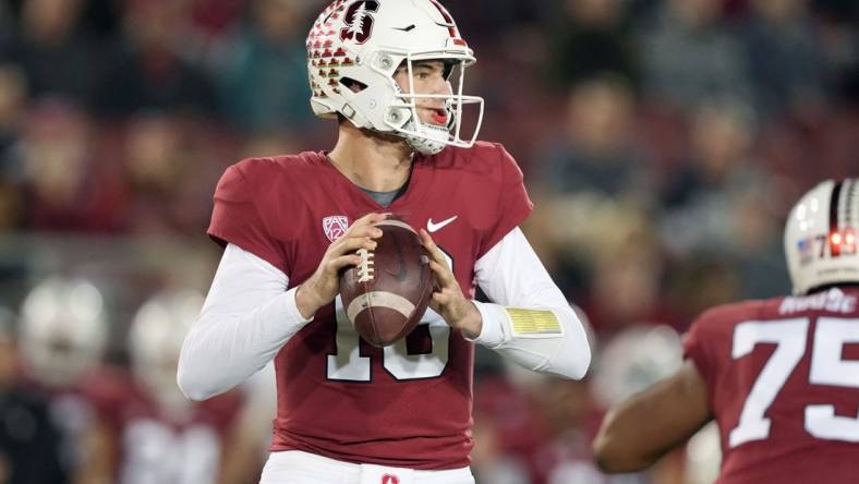 Nov 27, 2021; Stanford, California, USA; Stanford Cardinal quarterback Tanner McKee (18) drops back to pass during the first quarter against the Notre Dame Fighting Irish at Stanford Stadium. Mandatory Credit: Darren Yamashita-USA TODAY Sports