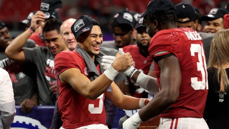 Dec 4, 2021; Atlanta, GA, USA; Alabama Crimson Tide quarterback Bryce Young (9) celebrates with linebacker Will Anderson Jr. (31) after their win during the SEC championship game after the Georgia Bulldogs at Mercedes-Benz Stadium. Mandatory Credit: Jason Getz-USA TODAY Sports