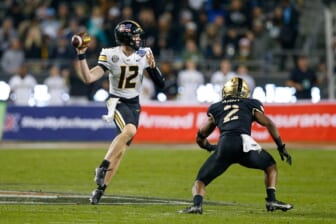 Dec 22, 2021; Fort Worth, Texas, USA; Missouri Tigers quarterback Brady Cook (12) throws with Army Black Knights linebacker Malkelm Morrison (2) defending during the third quarter of the 2021 Armed Forces Bowl at Amon G. Carter Stadium. Mandatory Credit: Andrew Dieb-USA TODAY Sports