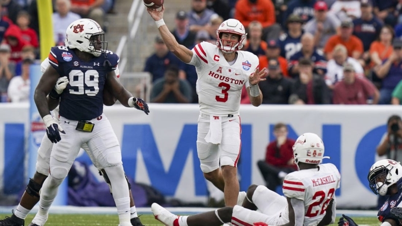 Dec 28, 2021; Birmingham, Alabama, USA; Houston Cougars quarterback Clayton Tune (3) passes against the Auburn Tigers during the second half of the 2021 Birmingham Bowl at Protective Stadium. Mandatory Credit: Marvin Gentry-USA TODAY Sports