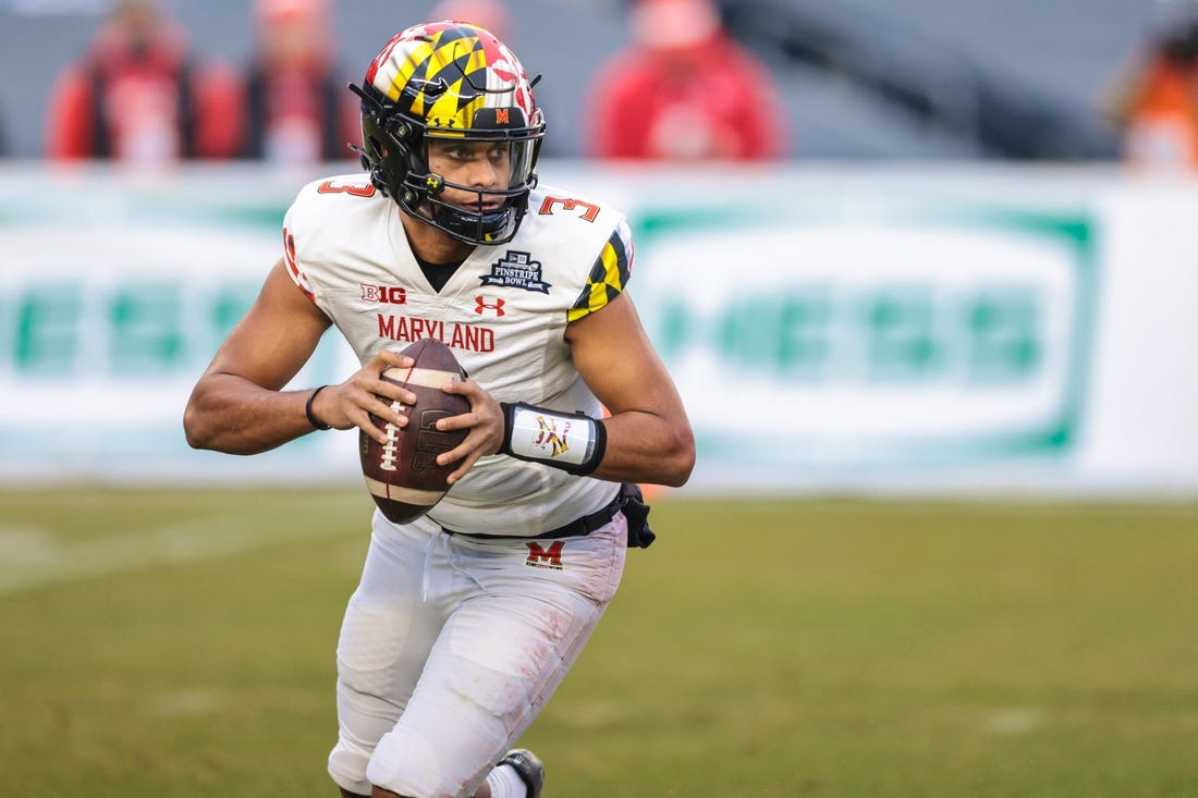 Dec 29, 2021; New York, NY, USA; Maryland Terrapins quarterback Taulia Tagovailoa (3) rolls out in the first half during the 2021 Pinstripe Bowl against the Virginia Tech Hokies at Yankee Stadium. Mandatory Credit: Vincent Carchietta-USA TODAY Sports