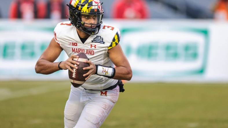 Dec 29, 2021; New York, NY, USA; Maryland Terrapins quarterback Taulia Tagovailoa (3) rolls out in the first half during the 2021 Pinstripe Bowl against the Virginia Tech Hokies at Yankee Stadium. Mandatory Credit: Vincent Carchietta-USA TODAY Sports