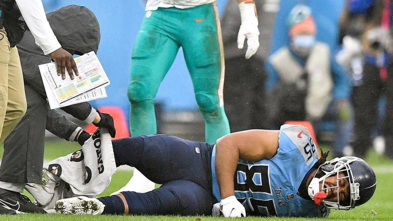 Tennessee Titans tight end MyCole Pruitt (85) lies on the field after he was injured during the second quarter at Nissan Stadium Sunday, Jan. 2, 2022 in Nashville, Tenn.

Titans Dolphins 097