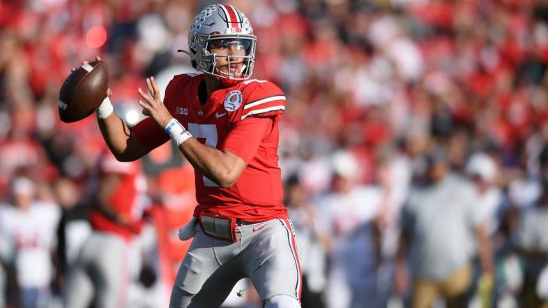 Jan 1, 2022; Pasadena, CA, USA; Ohio State Buckeyes quarterback C.J. Stroud (7) throws a pass against the Utah Utes in the first quarter during the 2022 Rose Bowl college football game at the Rose Bowl. Mandatory Credit: Orlando Ramirez-USA TODAY Sports