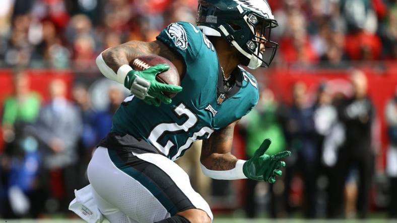 Jan 16, 2022; Tampa, Florida, USA;Philadelphia Eagles running back Miles Sanders (26) runs with the ball against the Tampa Bay Buccaneers during the first quarter in a NFC Wild Card playoff football game at Raymond James Stadium. Mandatory Credit: Kim Klement-USA TODAY Sports