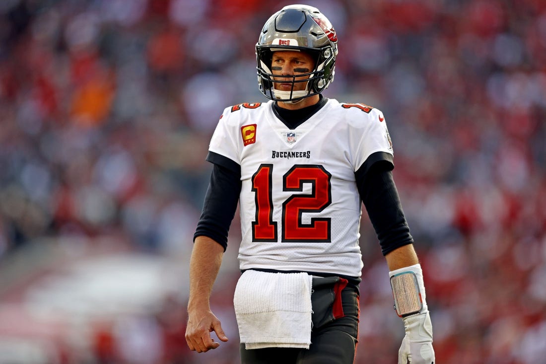 Jan 23, 2022; Tampa, Florida, USA; Tampa Bay Buccaneers quarterback Tom Brady (12) reacts during the first half against the Los Angeles Rams in a NFC Divisional playoff football game at Raymond James Stadium. Mandatory Credit: Nathan Ray Seebeck-USA TODAY Sports