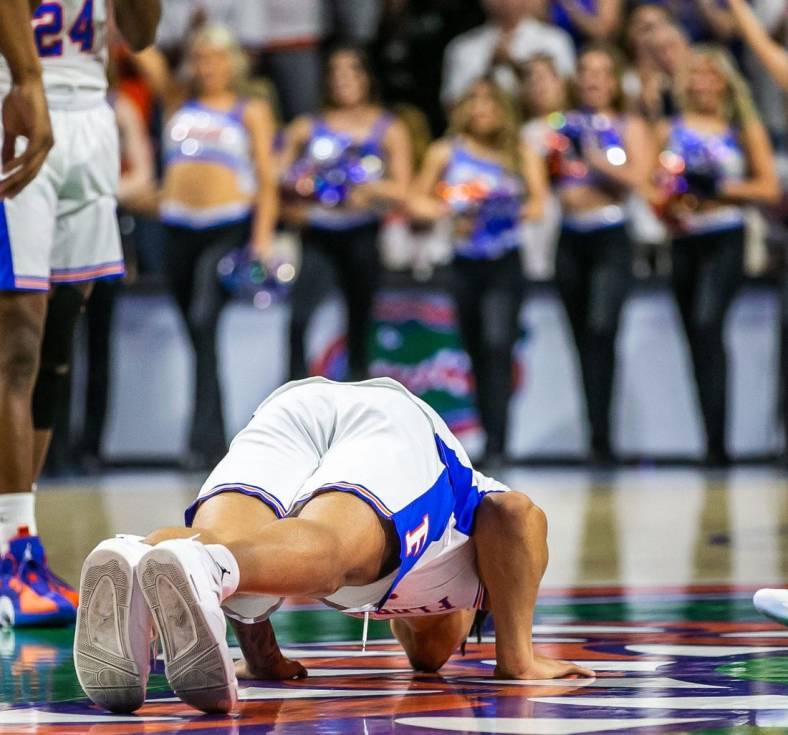 Florida Gators forward Keyontae Johnson (11) kisses the Gator logo after ceremonially starting the game Saturday. Johnson fainted during a game last year and took a one lump sum of $5 million insurance payout. The Kentucky Wildcats lead 38-26 at the half over the Florida Gators Saturday afternoon, March 5, 2022 at the Stephen C. O'Connell Center in Gainesville, FL. [Doug Engle/Ocala Star Banner]2022

Gai Uf Kentucky Basketball