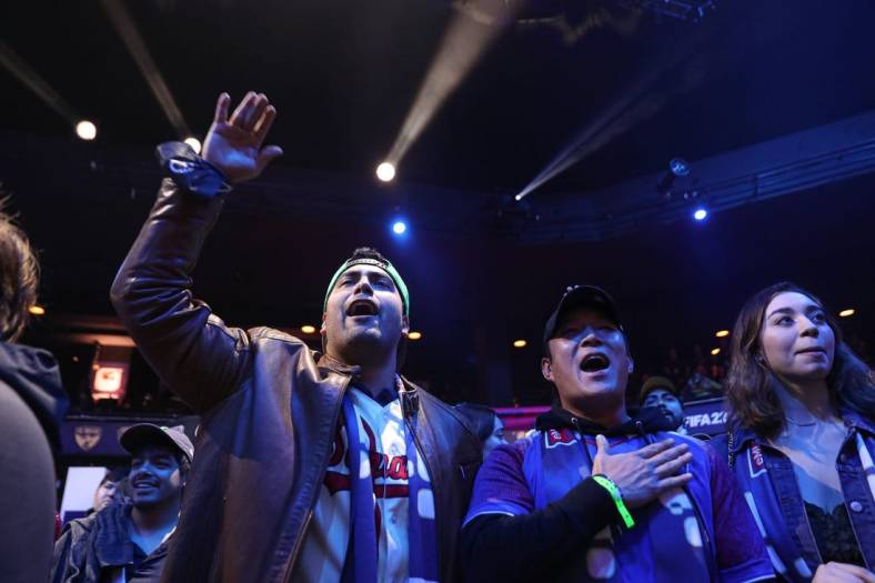 Fans Mark Escamilla, left, and John Chun, right, cheer for Austin FC eMLS player John Garcia during the eMLS Cup tournament at the Moody Theater on March 13, 2022. The eMLS Cup is the championship tournament that determines which player is the best FIFA esports player in North America.

Aem Sxsw Emls Cup 17