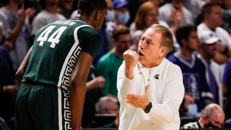 Michigan State coach Tom Izzo talks to forward Gabe Brown during the second half of MSU's 85-76 loss in the second round of the NCAA tournament on Sunday, March 20, 2022, in Greenville, South Carolina.