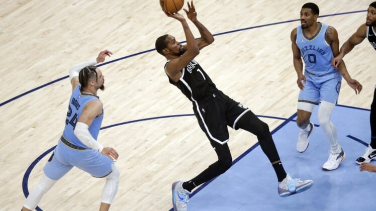 Mar 23, 2022; Memphis, Tennessee, USA; Brooklyn Nets forward Kevin Durant (7) shoots during the second half against the Memphis Grizzlies at FedExForum. Mandatory Credit: Petre Thomas-USA TODAY Sports