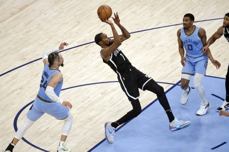 Mar 23, 2022; Memphis, Tennessee, USA; Brooklyn Nets forward Kevin Durant (7) shoots during the second half against the Memphis Grizzlies at FedExForum. Mandatory Credit: Petre Thomas-USA TODAY Sports