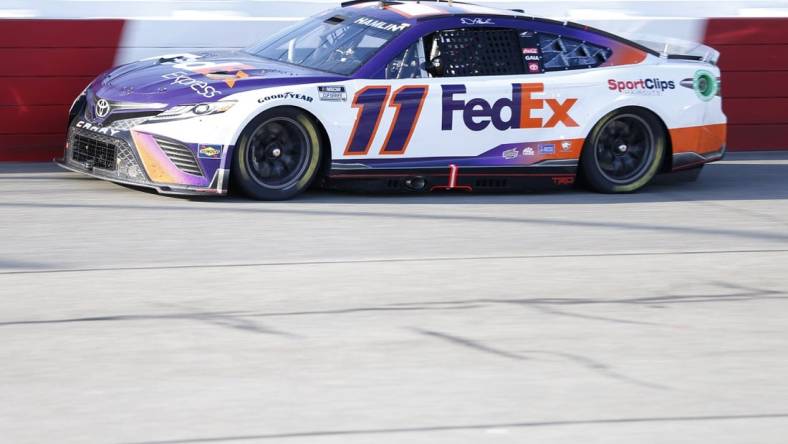 Apr 3, 2022; Richmond, Virginia, USA; NASCAR Cup Series driver Denny Hamlin (11) races during the Toyota Owners 400 at Richmond International Raceway. Mandatory Credit: Amber Searls-USA TODAY Sports