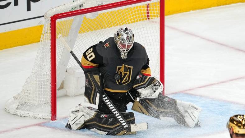 Apr 6, 2022; Las Vegas, Nevada, USA; Vegas Golden Knights goaltender Robin Lehner (90) makes a save against the Vancouver Canucks during the third period at T-Mobile Arena. Mandatory Credit: Stephen R. Sylvanie-USA TODAY Sports