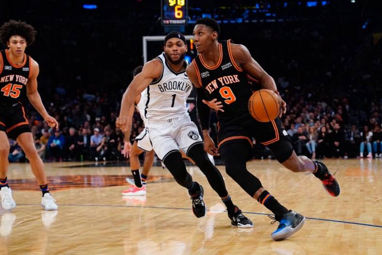 Apr 6, 2022; New York, New York, USA; New York Knicks shooting guard RJ Barrett (9) dribbles the ball against Brooklyn Nets small forward Bruce Brown (1) during the second half at Madison Square Garden. Mandatory Credit: Gregory Fisher-USA TODAY Sports