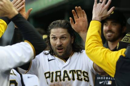 Apr 16, 2022; Pittsburgh, Pennsylvania, USA;  Pittsburgh Pirates left fielder Jake Marisnick (41) high-fives in the dugout after scoring a run against the Washington Nationals during the second inning at PNC Park. Mandatory Credit: Charles LeClaire-USA TODAY Sports