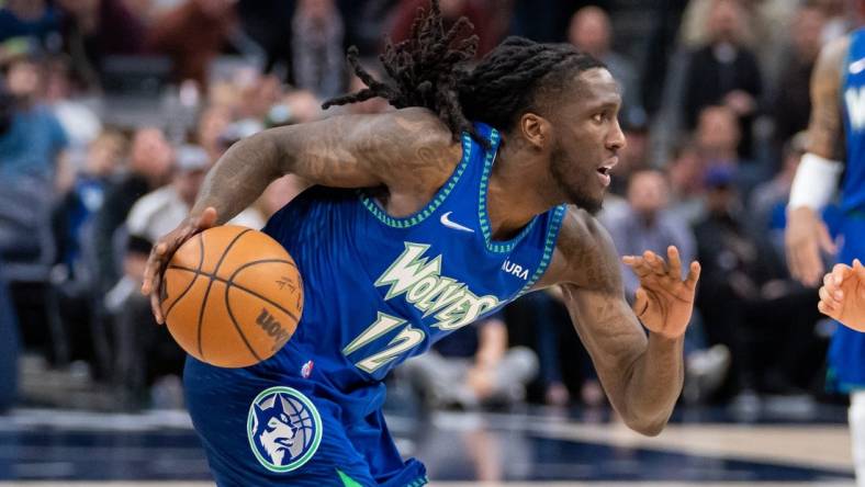 Apr 21, 2022; Minneapolis, Minnesota, USA; Minnesota Timberwolves forward Taurean Prince (12) dribbles against the Memphis Grizzlies in the thirdn quarter during game one of the three round for the 2022 NBA playoffs at Target Center. Mandatory Credit: Brad Rempel-USA TODAY Sports