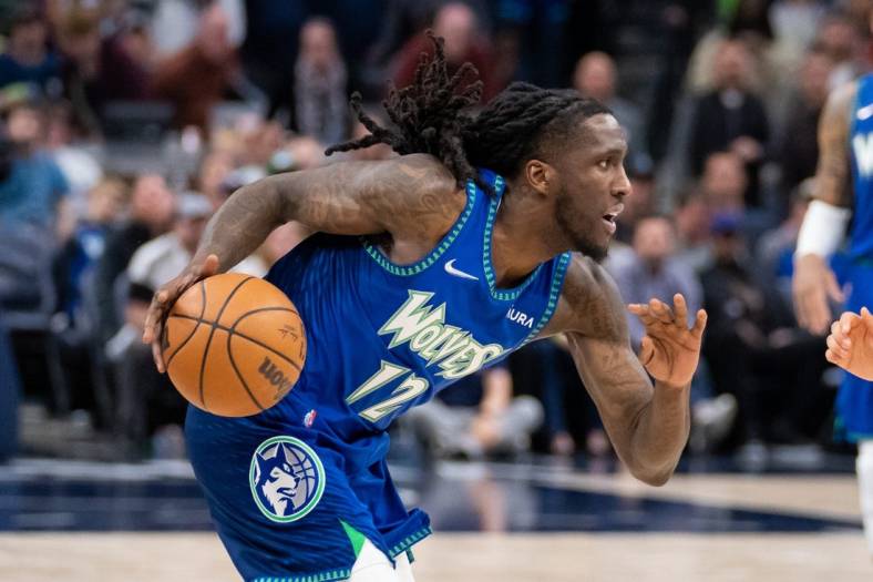 Apr 21, 2022; Minneapolis, Minnesota, USA; Minnesota Timberwolves forward Taurean Prince (12) dribbles against the Memphis Grizzlies in the thirdn quarter during game one of the three round for the 2022 NBA playoffs at Target Center. Mandatory Credit: Brad Rempel-USA TODAY Sports