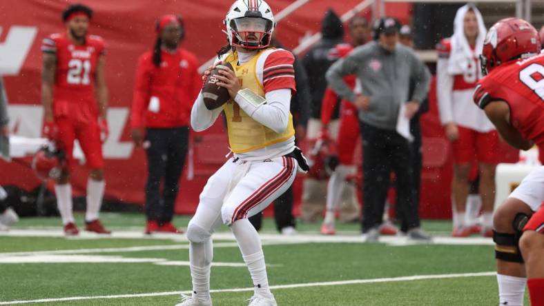 Apr 23, 2022; Salt Lake City, Utah, USA; Utah Utes junior quarterback Cameron Rising (7) looks to throw the ball in the first quarter of the Utah Spring Football Game at Rice   Eccles Stadium. Mandatory Credit: Rob Gray-USA TODAY Sports