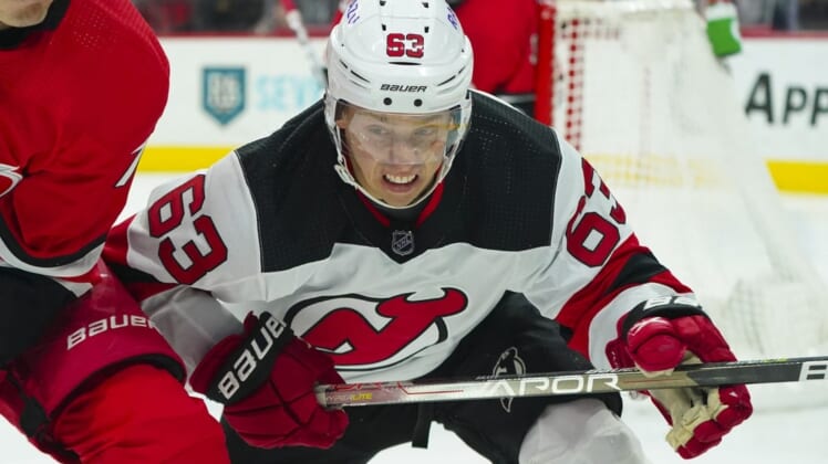 Apr 28, 2022; Raleigh, North Carolina, USA;  New Jersey Devils left wing Jesper Bratt (63) reacts against the Carolina Hurricanes during the second period at PNC Arena. Mandatory Credit: James Guillory-USA TODAY Sports