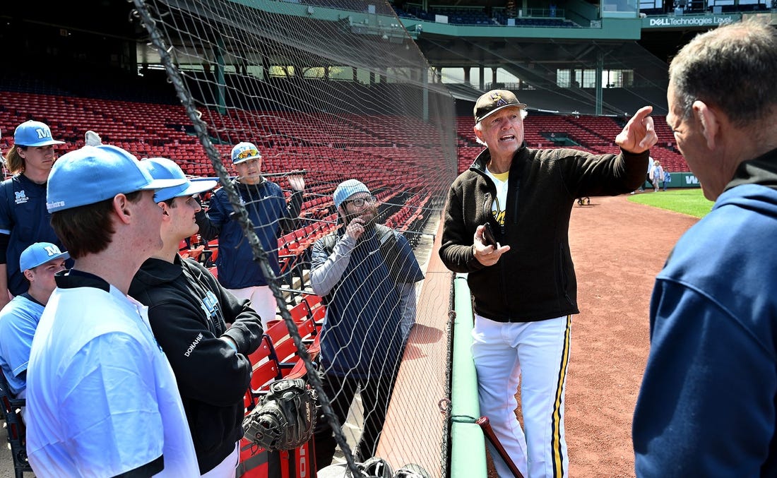 The Medfield baseball team listens to legendary Red Sox pitcher Bill "The Spaceman" Lee before the Fenway Park matchup against Hopkinton,  April 29, 2022. Lee, 75, was in the uniform for his Savannah Bananas travel team.

9543113002p Bos Fenway