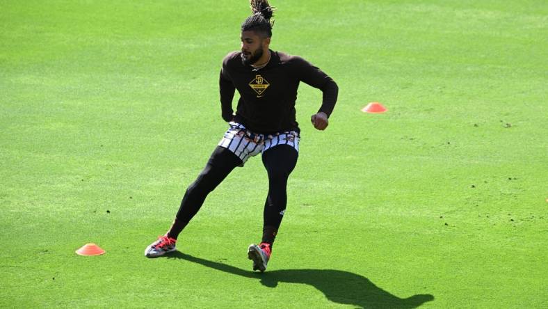 May 5, 2022; San Diego, California, USA; San Diego Padres shortstop Fernando Tatis Jr. (23) works out before the game against the Miami Marlins at Petco Park. Tatis Jr. is currently on the 60-day injured list. Mandatory Credit: Orlando Ramirez-USA TODAY Sports