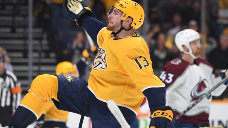 May 9, 2022; Nashville, Tennessee, USA; Nashville Predators center Yakov Trenin (13) celebrates after a goal during the first period against the Colorado Avalanche in game four of the first round of the 2022 Stanley Cup Playoffs at Bridgestone Arena. Mandatory Credit: Christopher Hanewinckel-USA TODAY Sports