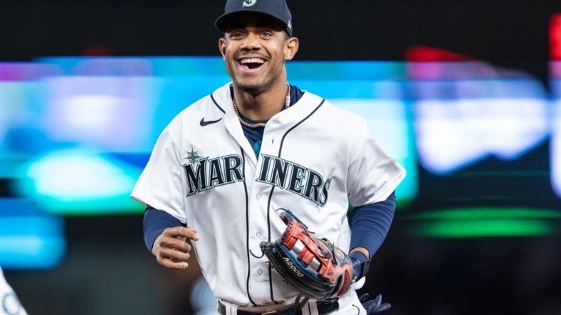 May 5, 2022; Seattle, Washington, USA; Seattle Mariners centerfielder Julio Rodriguez (44) smiles while jogging of the field during a game against the Tampa Bay Rays at T-Mobile Park. Mandatory Credit: Stephen Brashear-USA TODAY Sports