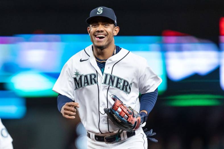 May 5, 2022; Seattle, Washington, USA; Seattle Mariners centerfielder Julio Rodriguez (44) smiles while jogging of the field during a game against the Tampa Bay Rays at T-Mobile Park. Mandatory Credit: Stephen Brashear-USA TODAY Sports