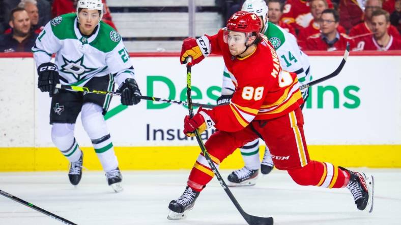 May 11, 2022; Calgary, Alberta, CAN; Calgary Flames left wing Andrew Mangiapane (88) shoot the puck against the Dallas Stars during the second period in game five of the first round of the 2022 Stanley Cup Playoffs at Scotiabank Saddledome. Mandatory Credit: Sergei Belski-USA TODAY Sports