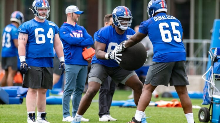 May 13, 2022; East Rutherford, NJ, USA;  New York Giants offensive lineman Marcus McKethan (60) practices a drill during rookie camp at Quest Diagnostics Training Center. Mandatory Credit: John Jones-USA TODAY Sports