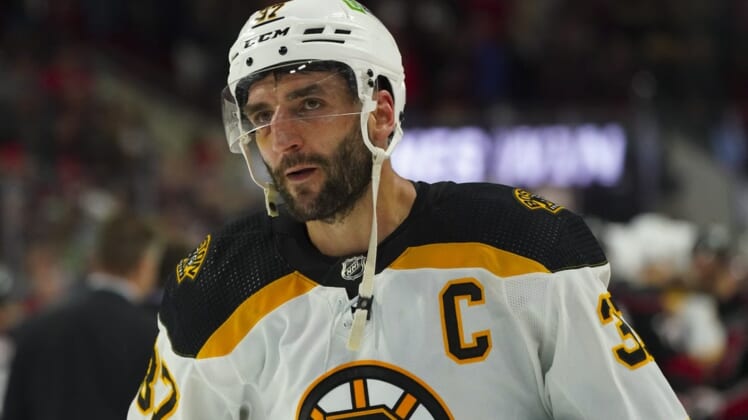 May 14, 2022; Raleigh, North Carolina, USA; Boston Bruins center Patrice Bergeron (37) leaves the ice after the game against the Carolina Hurricanes in game seven of the first round of the 2022 Stanley Cup Playoffs at PNC Arena. Mandatory Credit: James Guillory-USA TODAY Sports