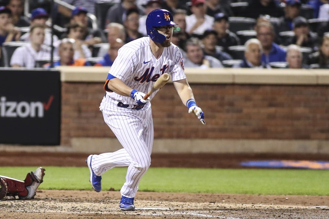 May 18, 2022; New York City, New York, USA;  New York Mets catcher Patrick Mazeika (4) hits a double in the fourth inning against the St. Louis Cardinals at Citi Field. Mandatory Credit: Wendell Cruz-USA TODAY Sports