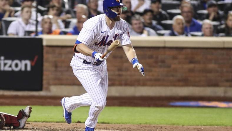 May 18, 2022; New York City, New York, USA;  New York Mets catcher Patrick Mazeika (4) hits a double in the fourth inning against the St. Louis Cardinals at Citi Field. Mandatory Credit: Wendell Cruz-USA TODAY Sports